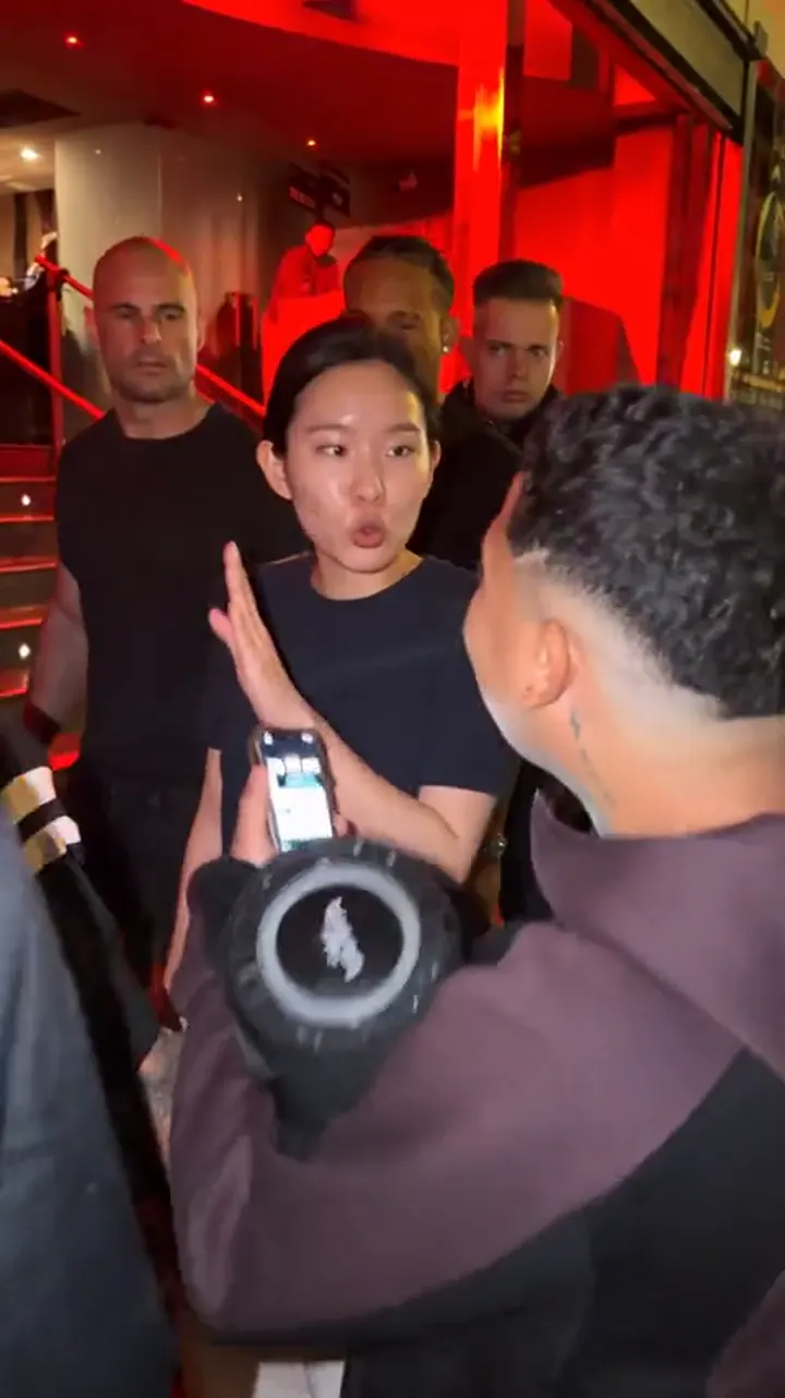 A later frame of the same kind of result: an AI-generated person mid-freestyle with the crowd and the speaker holder around them